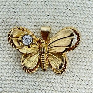 Vintage Textured Gold Tone Butterfly Pendant with Clear Rhinestone Accent